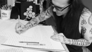 Damien Echols profile picture drawing at a table